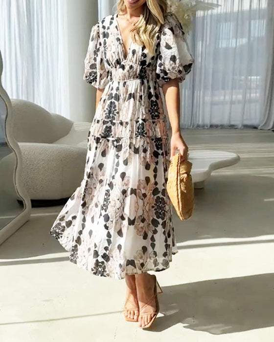 Printed dress with puff sleeves and V-neck